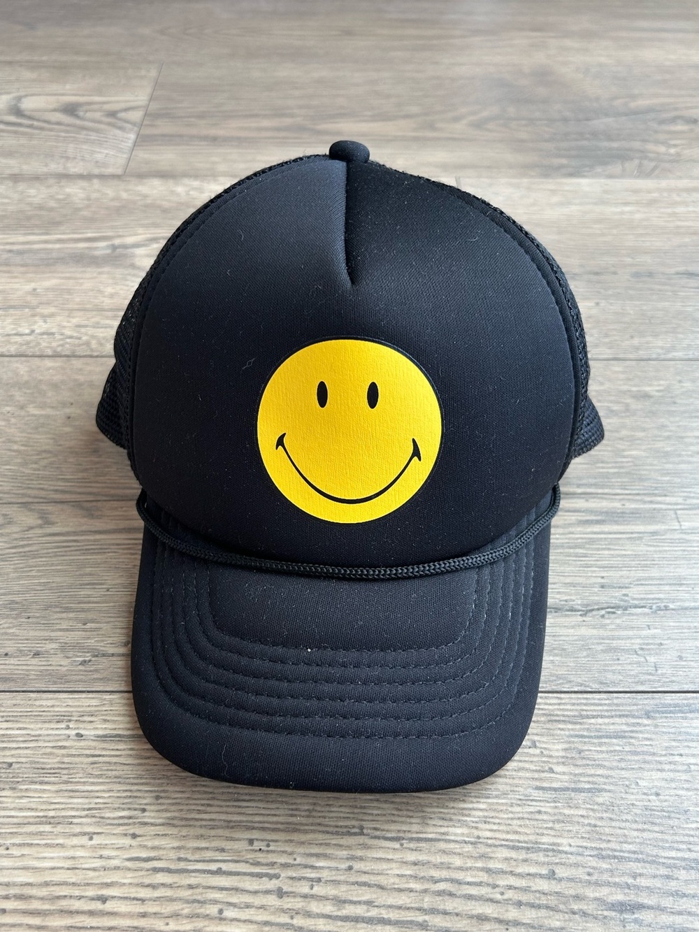 Smiley Black Trucker Hat with Yellow Smiley Face